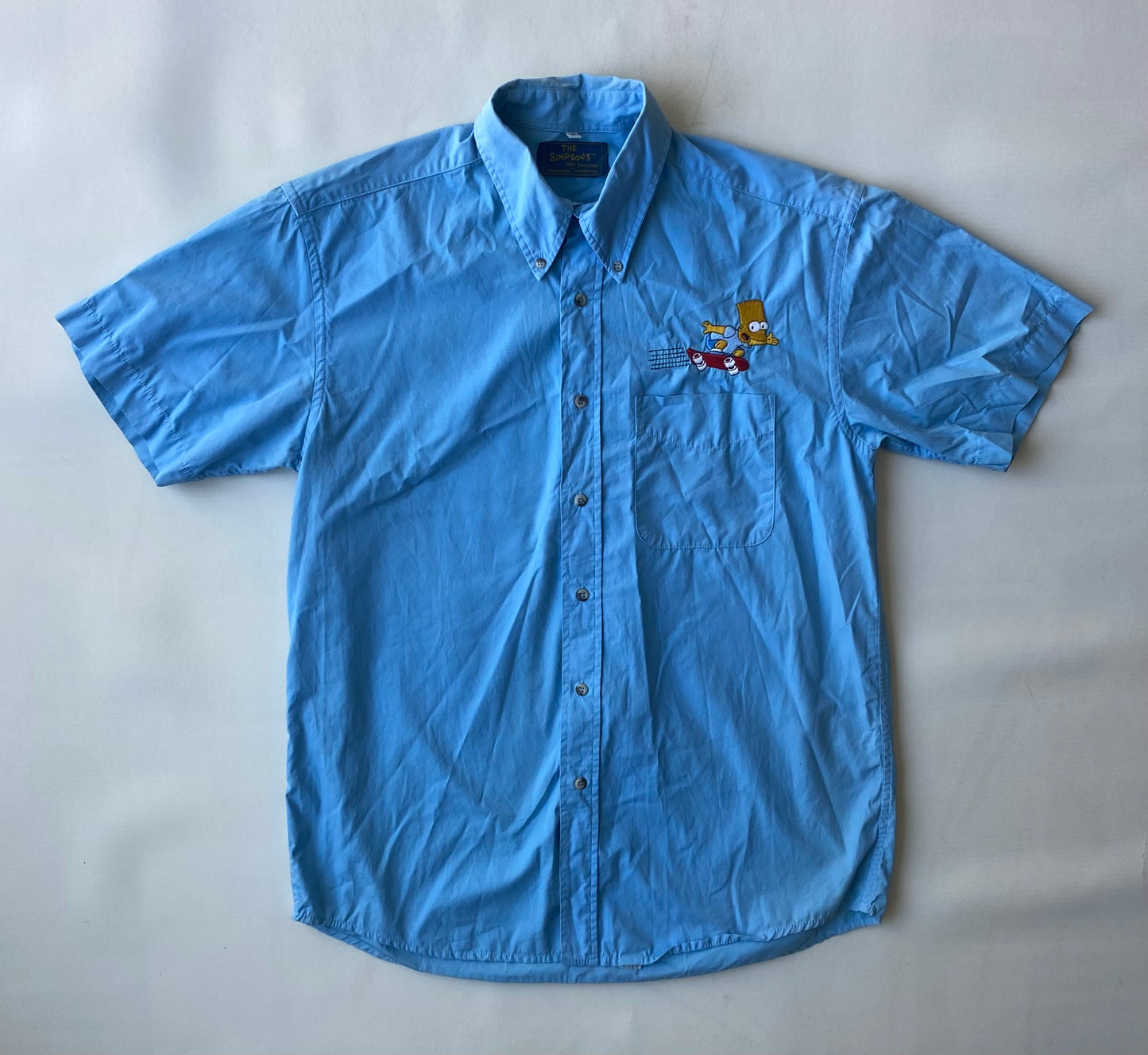 ✅ Chemisette collector Les Simpsons, bleu ciel, L