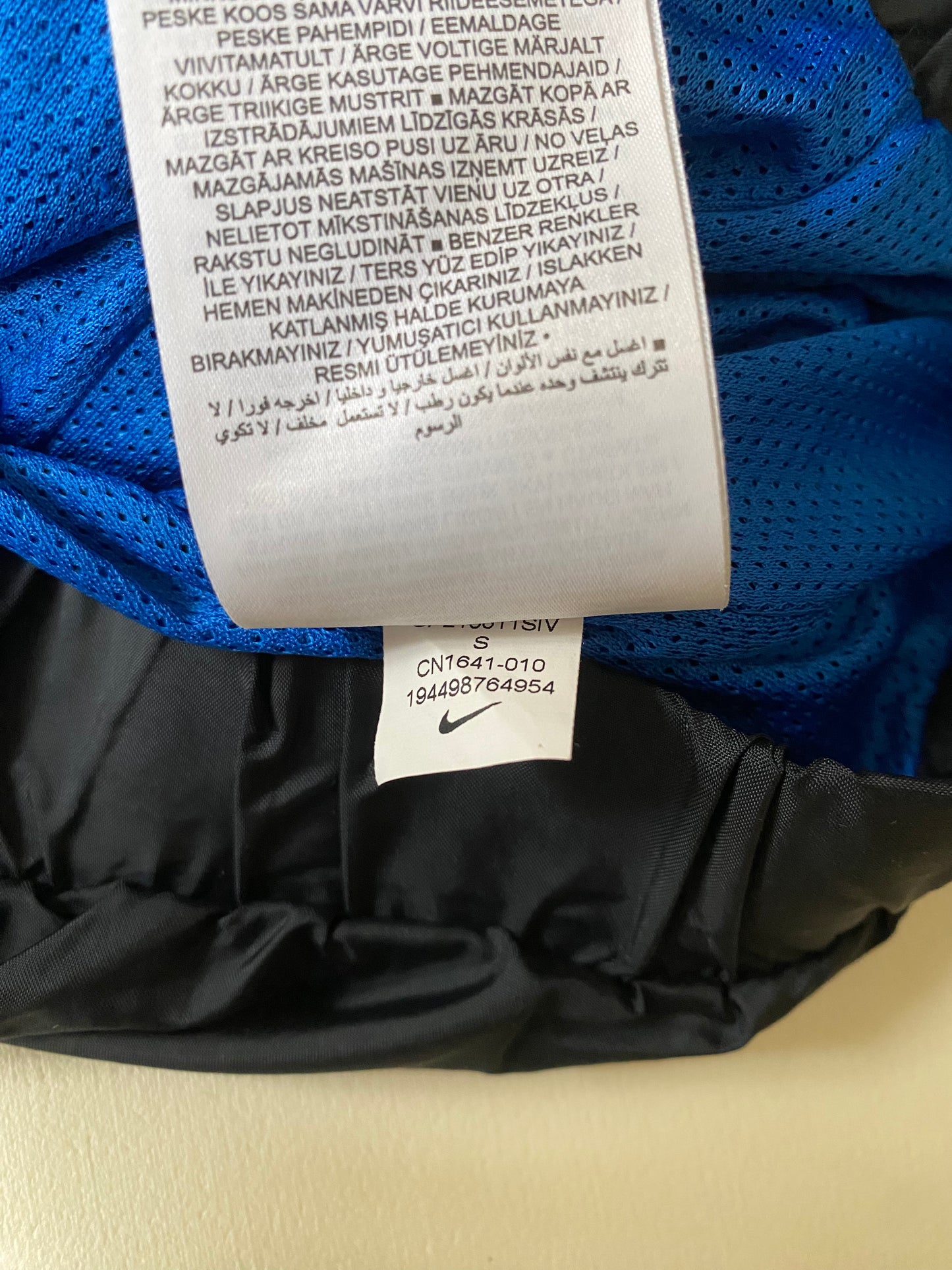 Veste coupe-vent / pluie à enfiler Nike, noir, S légèrement oversize