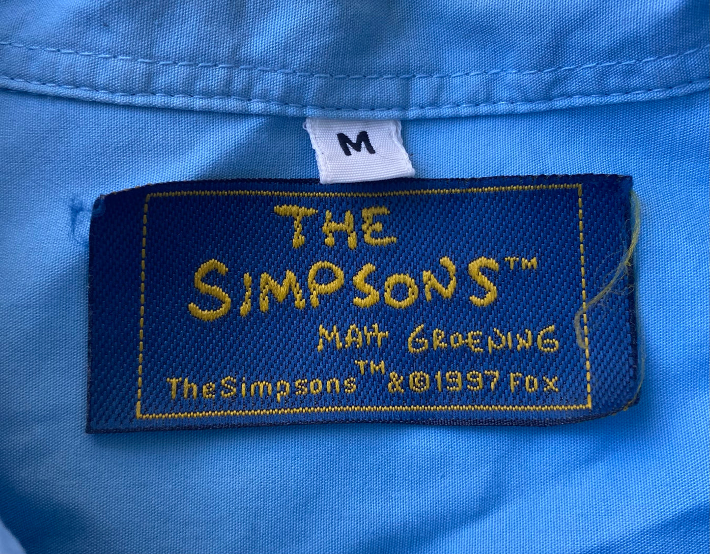 ✅ Chemisette collector Les Simpsons, bleu ciel, L