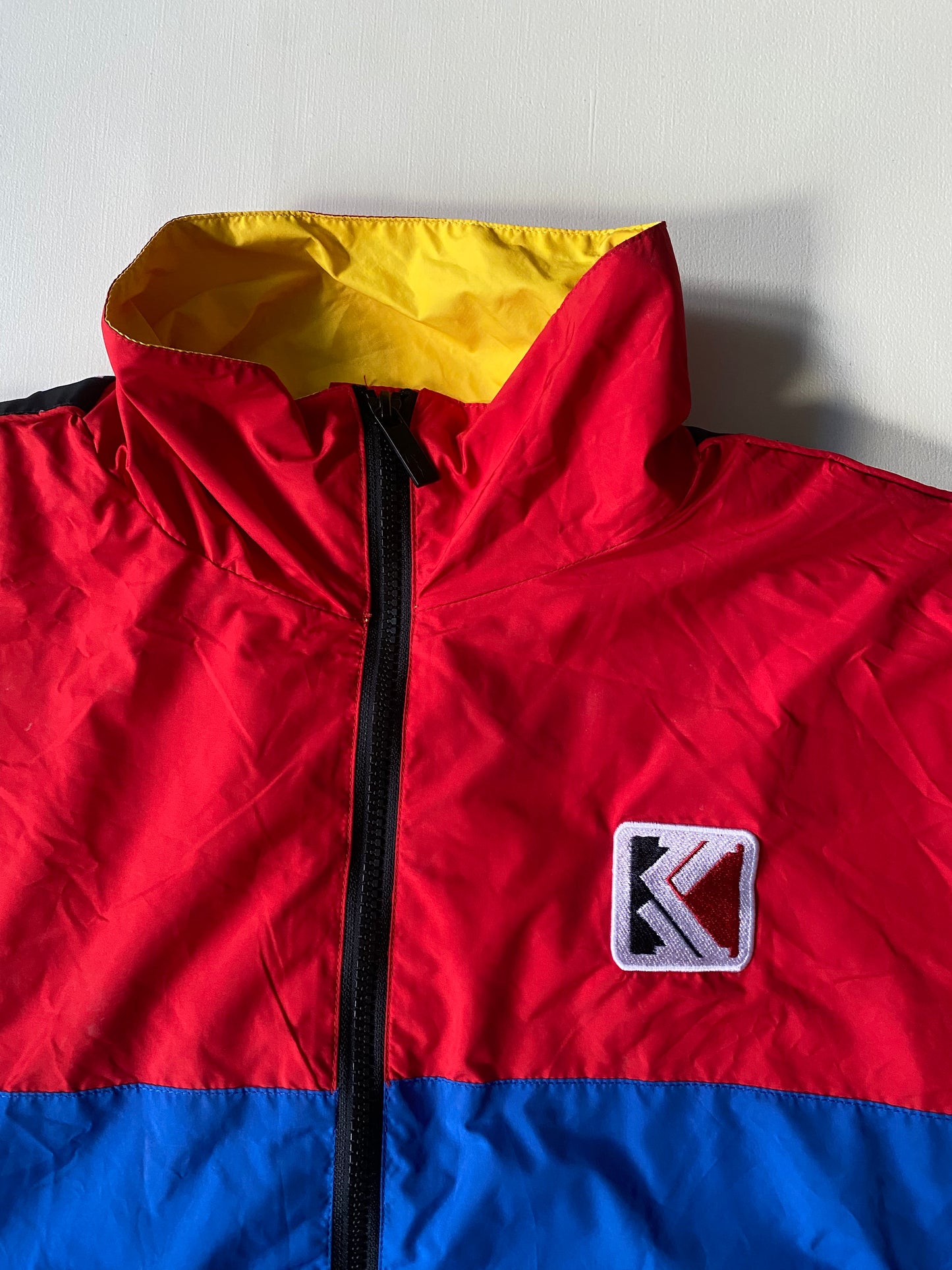 Veste coupe-vent Karl Kani, rouge et bleu, M légèrement oversize