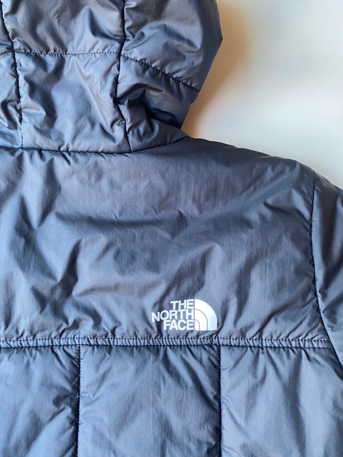 Doudoune réversible The North Face, noire, XL boys (M adulte)