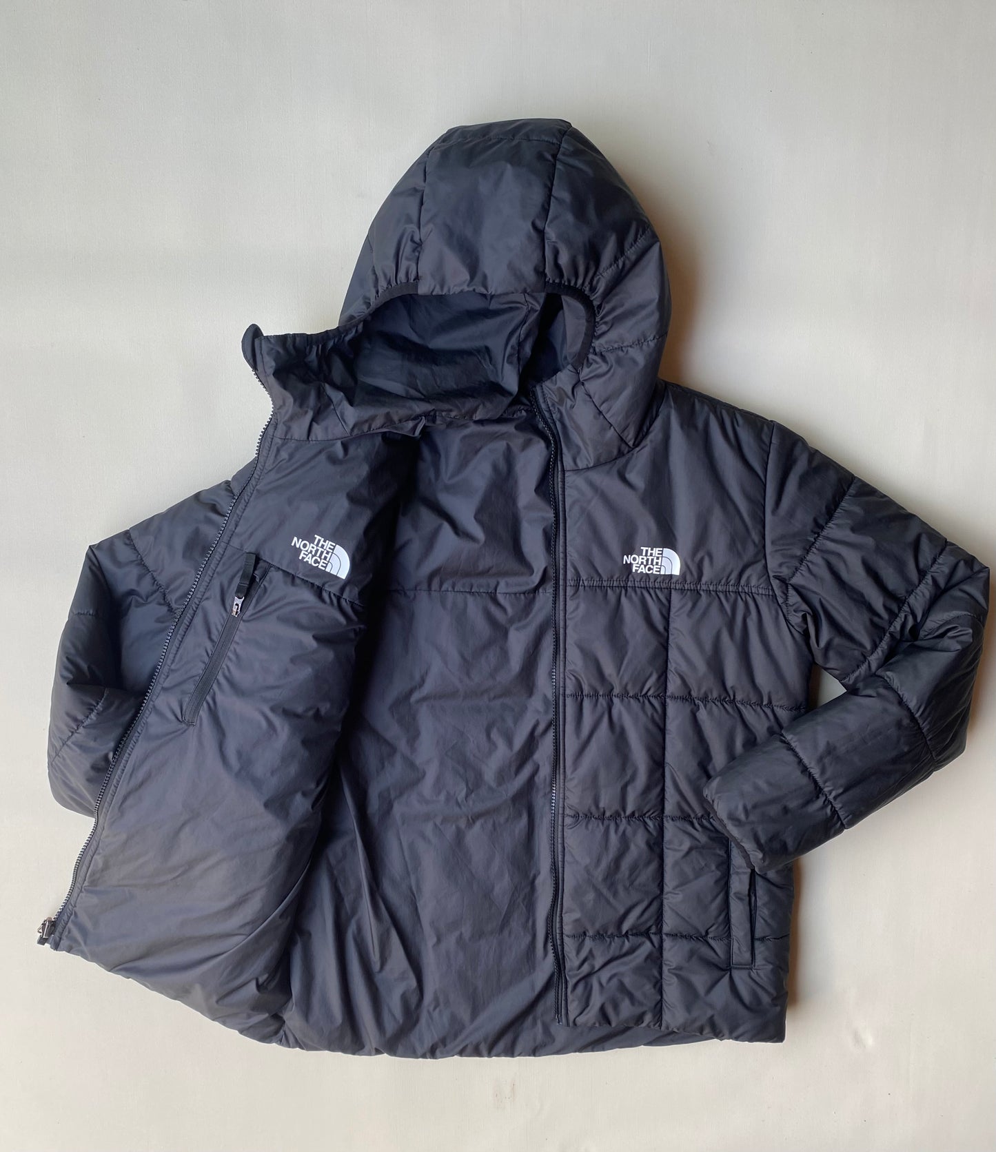 Doudoune réversible The North Face, noire, XL boys (M adulte)