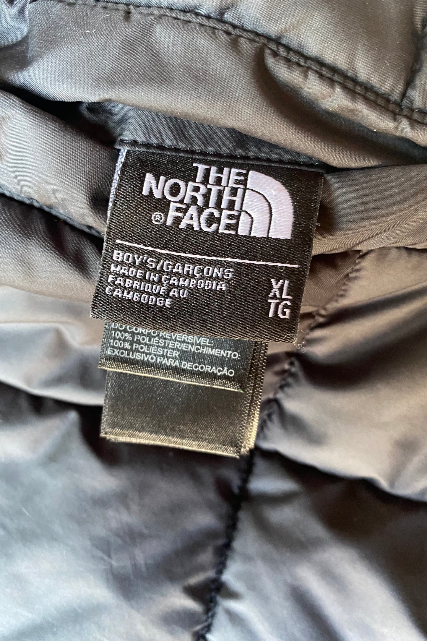 Doudoune réversible The North Face, noire, XL boys (M adulte)