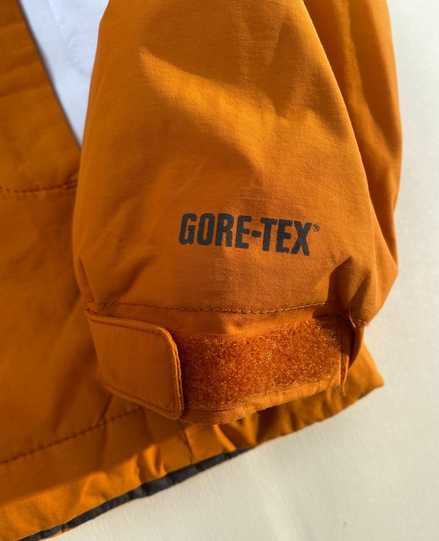 Veste goretex Salomon, orange/blanc/gris, M légèrement oversize